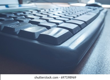 close up computer keyboard  on office  table. vintage toning