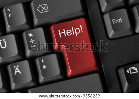 Close up of a computer keyboard with a red key showing "help!".