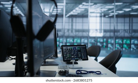 Close up of computer peripherals on server room desk used by employees working to ensure minimal downtime. Hard disk, keyboard and tablet in data center office used for monitoring performance