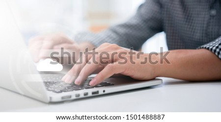 close up computer programmer man hand typing on keyboard for transfer or synch data upload and download from cloud computing with virtual interface in operation room, technology business concept	
