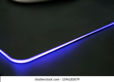 Close Up Of Computer RGB Gaming Mouse Pad, Illuminated By Colored LED