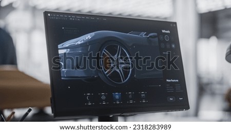 Close Up Computer Screen with 3D Customization Software for a Prototype Car. Gaming Experience for a Person Choosing Different Wheel Options for a Modern Automobile in a Vehicle Dealership Center