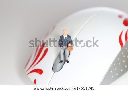 a Close up of a computermouse and figure
