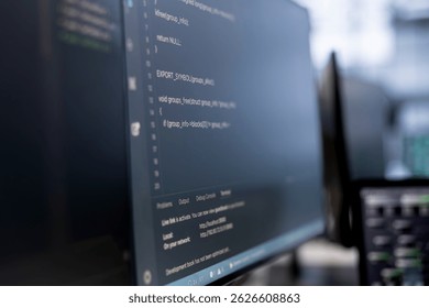 Close up of computers in empty data center facility managing rackmounts energy consumption. Binary script running on PC monitors used for automation and monitoring processes in server room