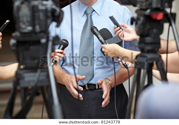 close up of conference meeting microphones\
and businessman