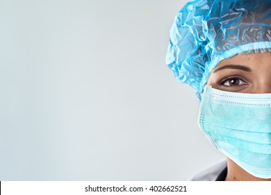 Close Up Of Confident Female Surgeon In Mask Getting Ready For Medical Procedure Surgery