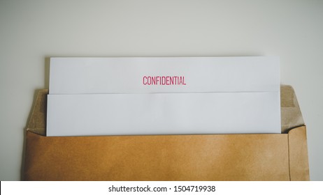 Close Up Confidential Document With Brown Bag.