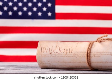 Close up Constitution of US on USA flag background. Declaration of Independence of the United States of America with american flag in the background. - Powered by Shutterstock