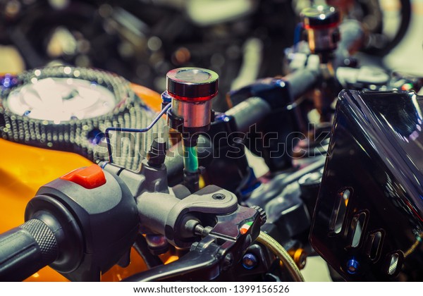 close up of the container of\
motorcycle brake fluid, brake master cylinder\
reservoir.