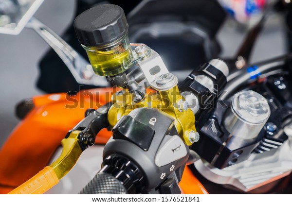 close up of the container of\
motorcycle brake fluid, brake master cylinder\
reservoir.