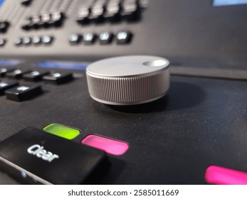 Close up of control wheel and buttons of light system console.