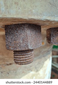 a close up corroded bolt n nut at the plant