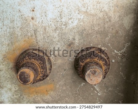 Close Up of Corroded Rusty Bolts and Nuts Installed on Steel Baseplate Structure