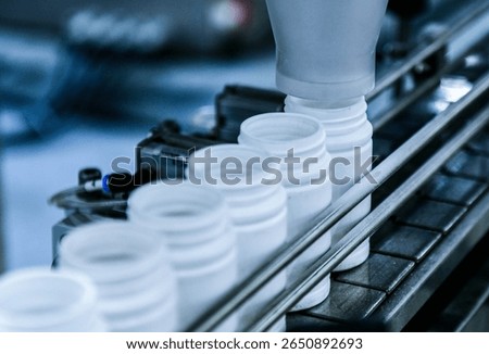Close up counting and automatic tablet bottling machine in the pharmaceutical industry production line