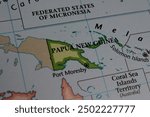 Close up of the country of Papua new Guinea viewed on a wold map as a travel concept. Papua new Guinea on a map