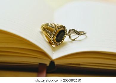 Close up couple ring on notebook,for Valentine’s Day,engagement ring.