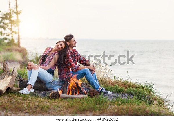 Close Couple Sitting Near Fire On Stock Photo (Edit Now) 448922692