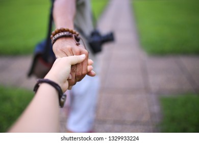Close up couple's hand in hand