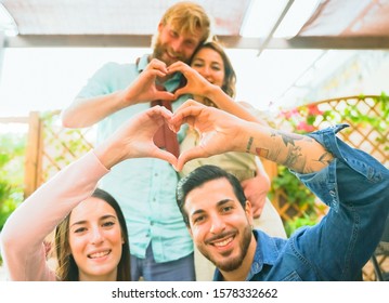 Close Up of couples making heart shape with hands. Happy couple in love.  Hands of a men and a women in the shape of a heart . Love and relationship concept.