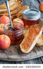 Close Up Of Crab Apple Jelly On A Slice Of Toasted Sourdough Bread.