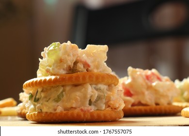 close up crab dip served with cracker -  homemade food
