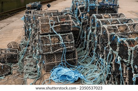 Close up of crab pots, lobster pots and fish traps on the quayside in the seaside village of Staithes on the North Yorkshire coast