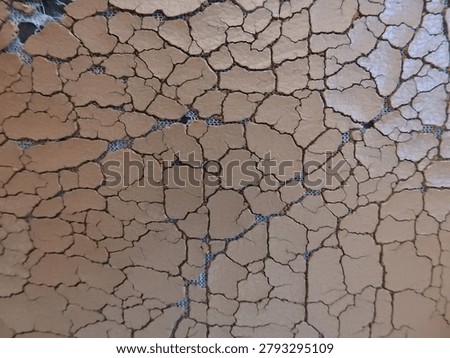 Close up of cracked sofa leather showcasing aged upholstery texture, worn surface patterns, and signs of material deterioration. Ideal for furniture, interior design, restoration, vintage, and abstract texture background themes.