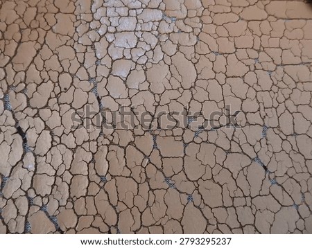 Close up of cracked sofa leather showcasing aged upholstery texture, worn surface patterns, and signs of material deterioration. Ideal for furniture, interior design, restoration, vintage, and abstract texture background themes.