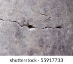 close up of cracked stone granite marble.  Crack caused by the 1906 san francisco earthquake and is found in golden gate park in a memorial.