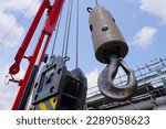 Close up crane hook for mobile crane in construction site and background is a scaffolding at chemical plant Industrial estate.                               