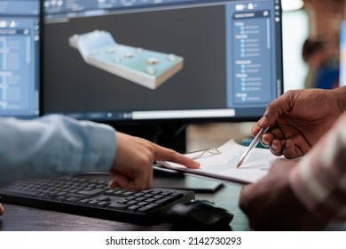 Close up of creative industry employees with clipboard and advanced 3D modeling software open in background. 3D digital artists reviewing sketch scene plan and simulated render times,