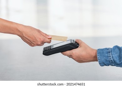 Close up of credit card contactless payment - Shutterstock ID 2021474651