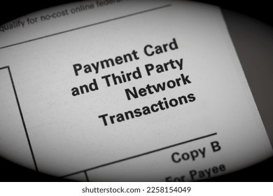 Close up of a credit card and third party network transaction reporting form. - Shutterstock ID 2258154049