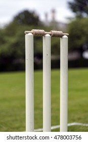 Close Up Of Cricket Stumps On A Traditional Grass Pitch