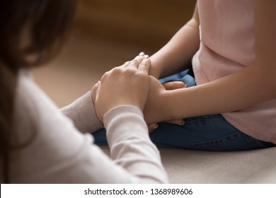 Close Up Cropped Image Loving Tender Mother Gently Touch Hands Of Little Daughter Kid Showing Protection Support Expressing Care And Love. Child Adoption Foster And Custody, Orphan And New Mom Concept