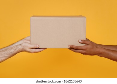 Close Up Cropped Men Hold In Hands Give Brown Clear Blank Paper Empty Cardboard Box Isolated On Yellow Background Packaging Template Mock Up Delivery Service Concept Free Copy Space Advertising Area