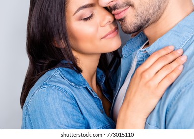 Close Up Cropped Portrait Of Beautiful Cute Lovely Couple Enjoying Each Other With Closed Eyes Over Grey Background, She Likes Smell, Perfume, Aroma, Scent Of Him