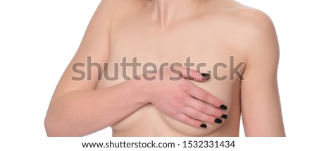 Close Up cropped portrait young woman with breast pain touching chest. Breast cancer concept