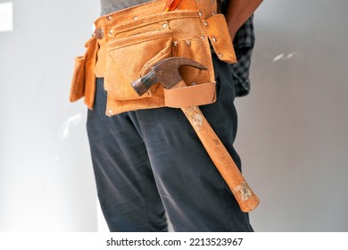 Close Up Cropped Shot Of A Man Wearing A Tool Belt With Tools For Home DIY