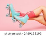 Close up cropped side profile view young woman she wearing modern blue rollers rollerblading raise up legs isolated on plain pastel light pink color wall background. Summer season hobby sport concept