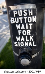 a close up of a crossing button with instructions