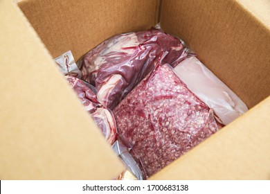 Close up of cryovac packed meat in a box home delivered