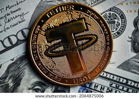 Close up of Cryptocurrency Tether coins with with dollar money