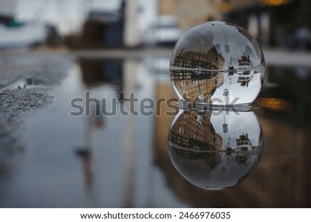 Close up of a crystal ball in a puddle 