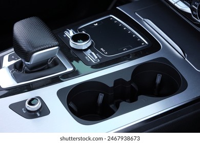 Close up cup holders and Selector automatic transmission. Cup holders inside modern car interior. Car inside.
