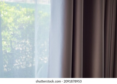 Close up curtain window with green garden background