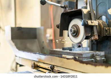 Close Up Cutting Or Grinding Wheel During Rotating Or Working With Product On High Accuracy And Automatic Surface Horizontal Grinding Machine For Finishing Process In Industrial Metal Work At Factory