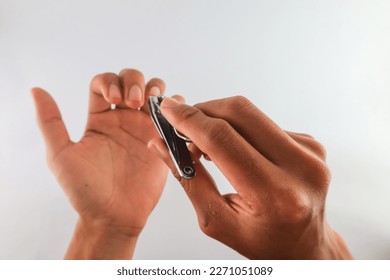 close up of cutting nails. concept of trimming fingernails. long and dirty fingernails healthy lifestyle. keep body clean. isolated on White Background - Shutterstock ID 2271051089