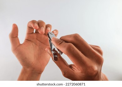 close up of cutting nails. concept of trimming fingernails. long and dirty fingernails healthy lifestyle. keep body clean. isolated on White Background - Shutterstock ID 2272060871