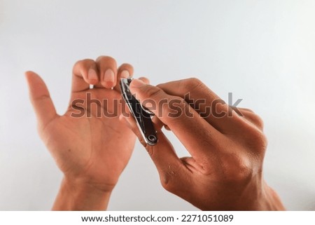 close up of cutting nails. concept of trimming fingernails. long and dirty fingernails healthy lifestyle. keep body clean. isolated on White Background